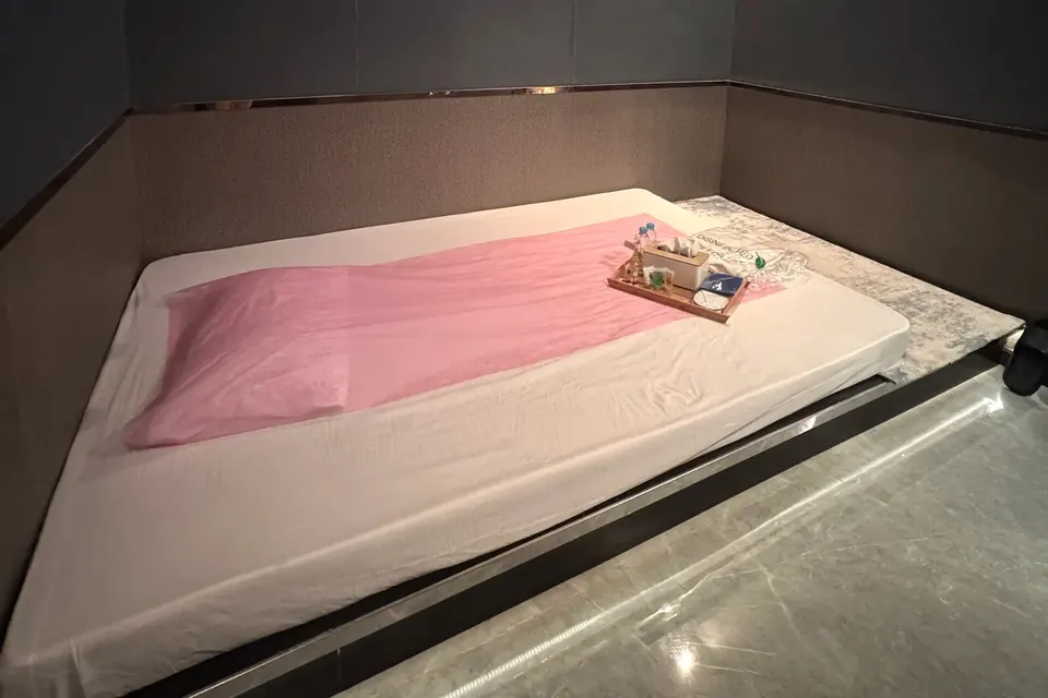 A private treatment room set with fresh linen